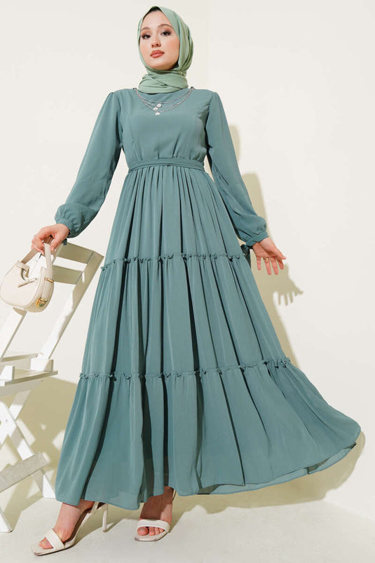 Robe à volants vert sauge avec nœud aux chevilles