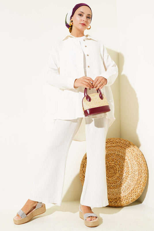 قميص أساسي بأزرار عند الكاحل باللون البيج