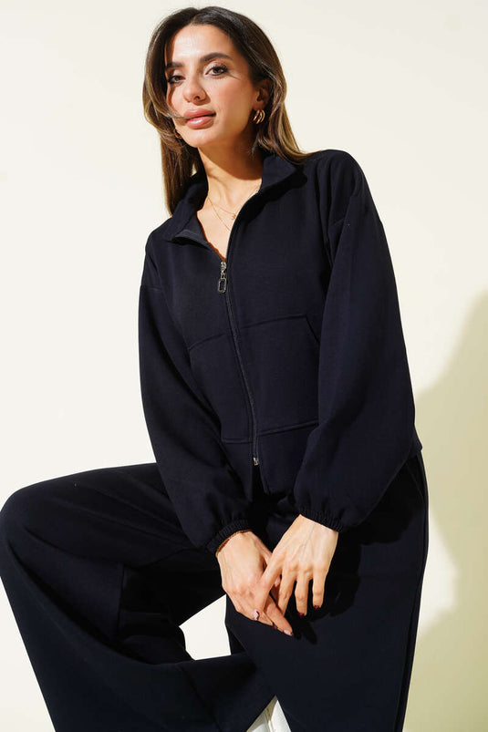 Losvallend tweedelig set met elastische manchetten en zakken, donkerblauw