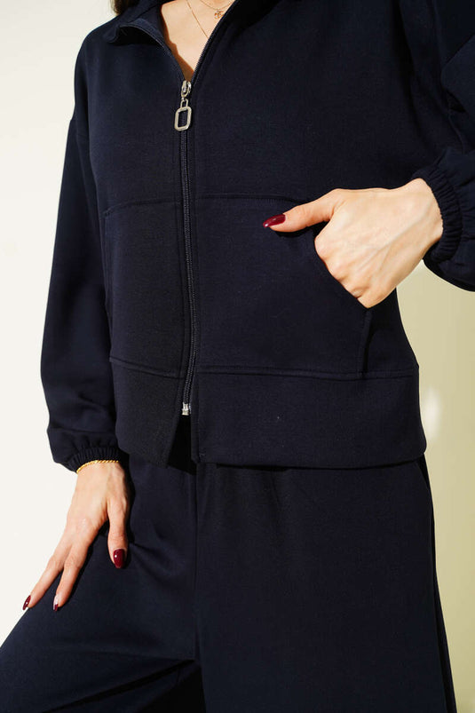 Losvallend tweedelig set met elastische manchetten en zakken, donkerblauw