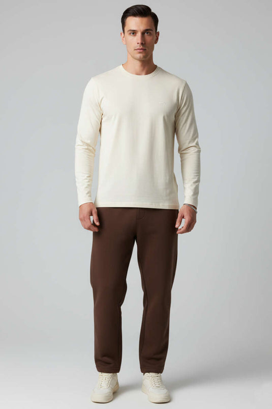 سويت شيرت كريمي اللون بأكمام طويلة وياقة دائرية