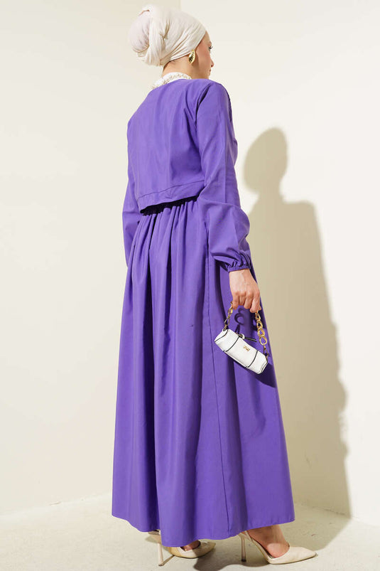 Ensemble deux pièces violet avec jupe boléro