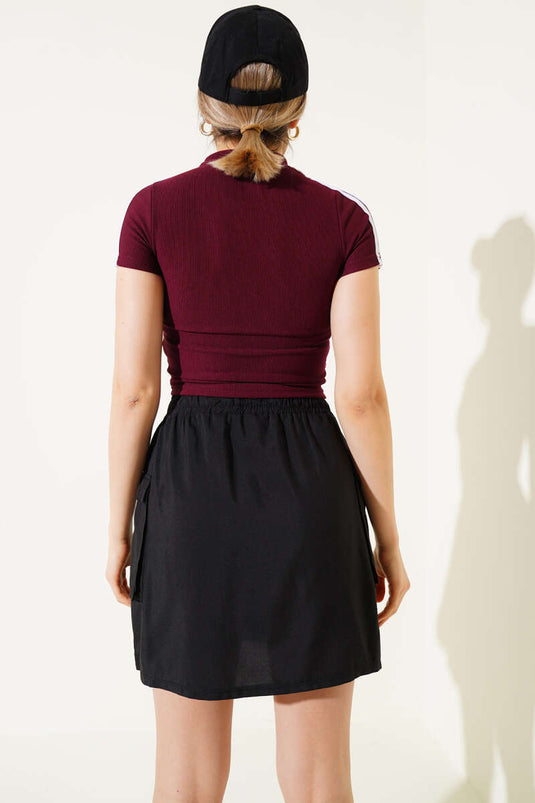 Haut court rayé bordeaux à fermeture éclair sur l'épaule