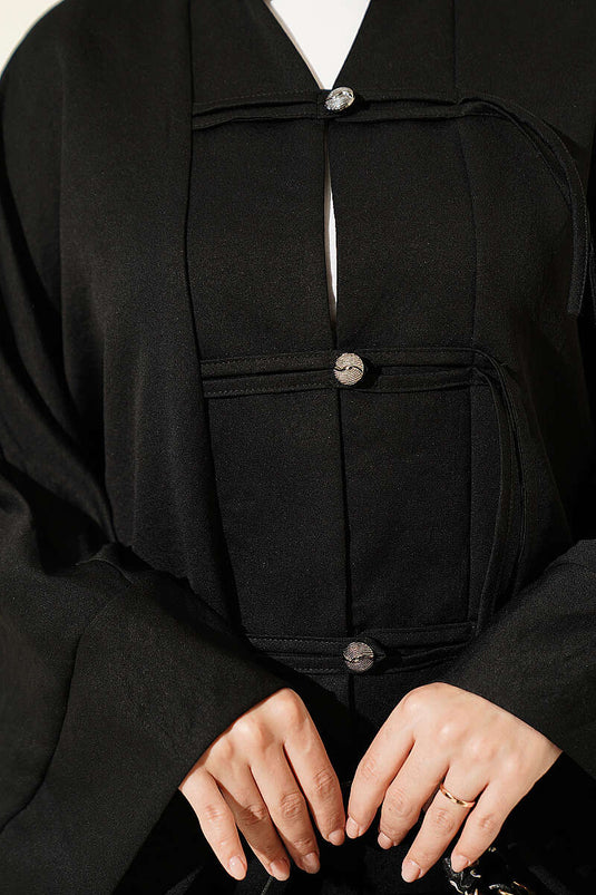 قميص أسود بأزرار وأكمام ياقوتة