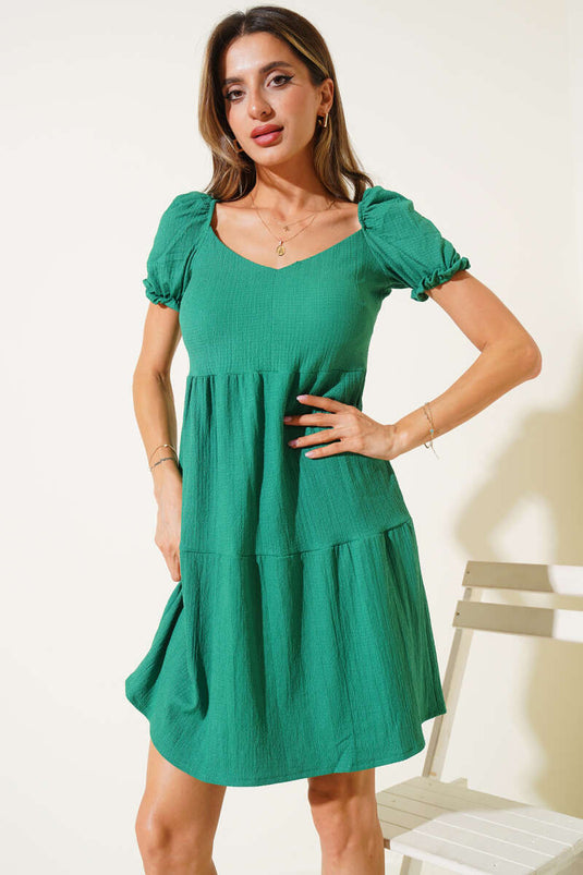 Robe verte en crêpe à manches ballon