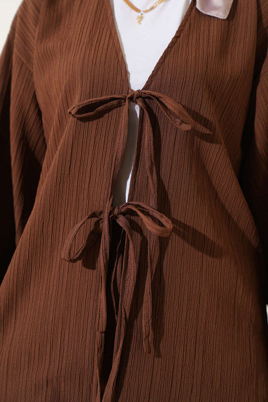 Costume deux pièces bordeaux à lacets sur le devant marron