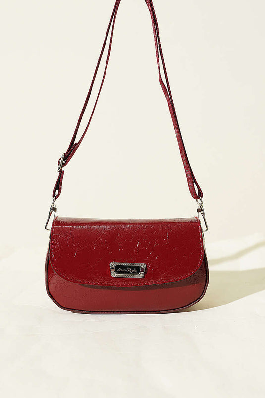 Sac en cuir verni à bandoulière croisée bordeaux