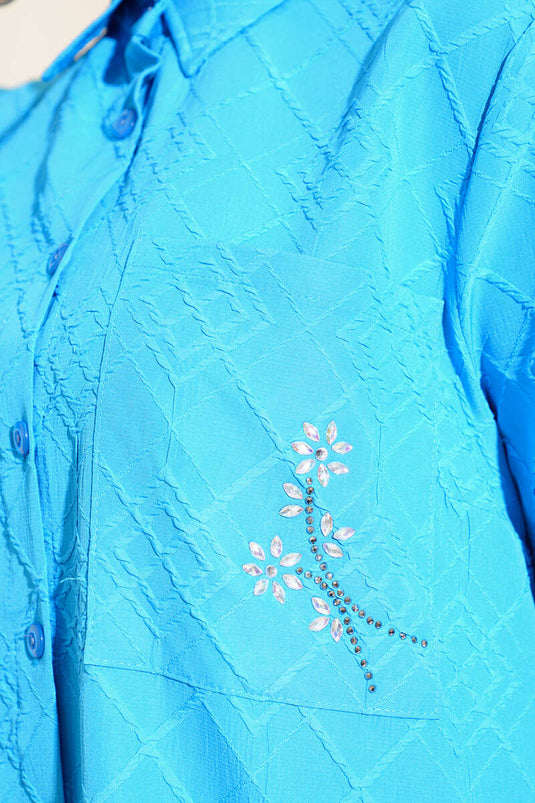 Blauwe tuniek met bloemensteenzak