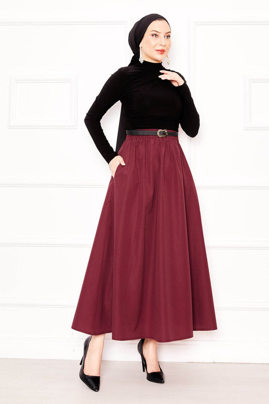 تنورة تيريكوتون رياضية بتفاصيل جيوب باللون الأحمر الداكن