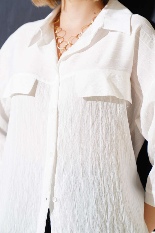 Chemise blanche à manches courtes et poches rabattues