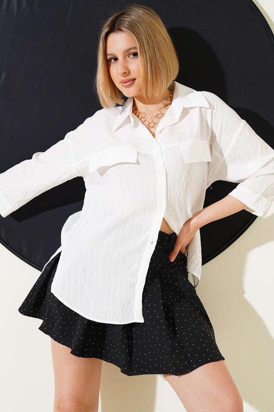 Chemise blanche à manches courtes et poches rabattues