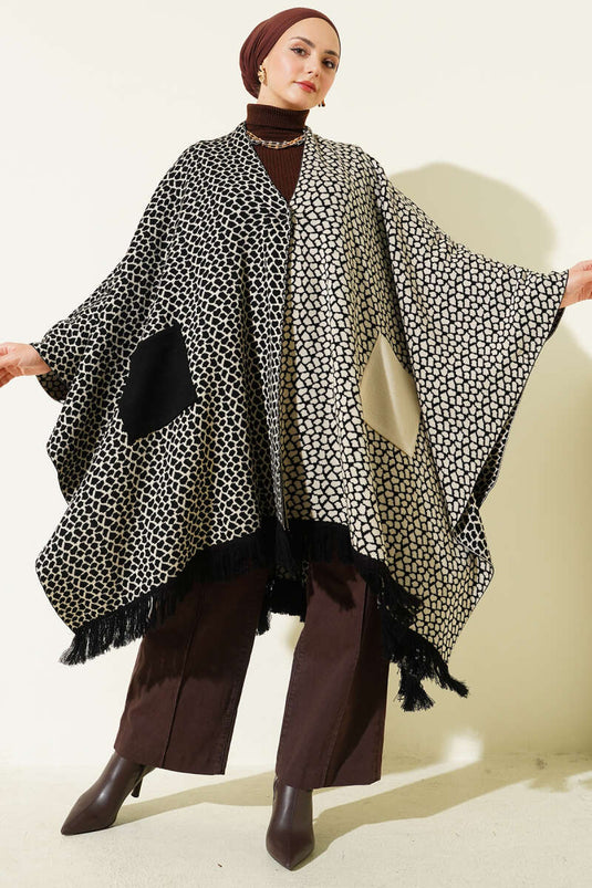Poncho en maille à motifs et à franges, avec poche et pierre