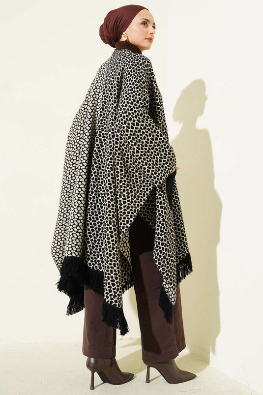 Poncho en maille à motifs et à franges, avec poche et pierre