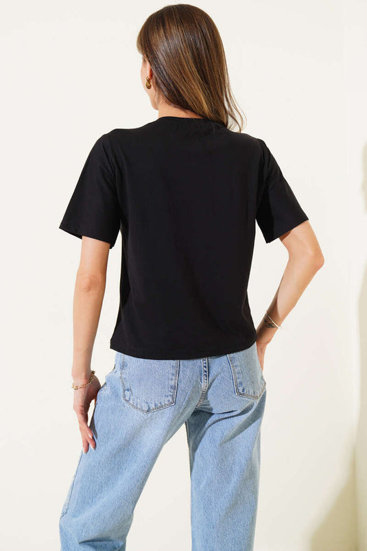 Black T-Shirt with Floral Accessories