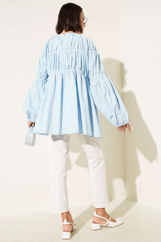 Tunica con maniche elastiche e dettagli floreali, colore azzurro