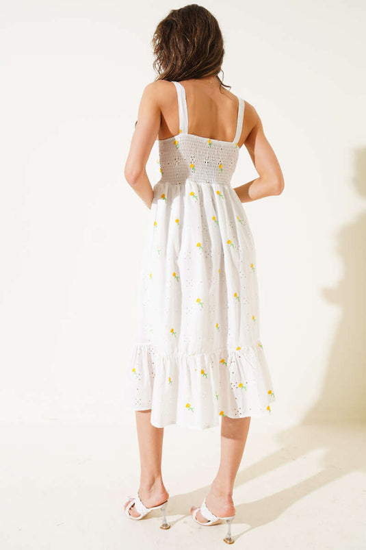 Gelbes Midikleid mit Blumenstickerei und Trägern