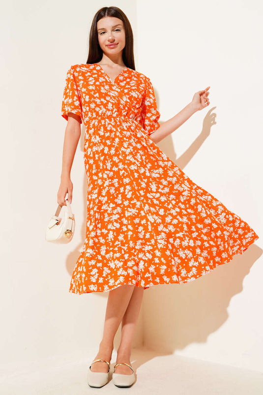 Robe orange à fleurs, taille élastique et manches courtes