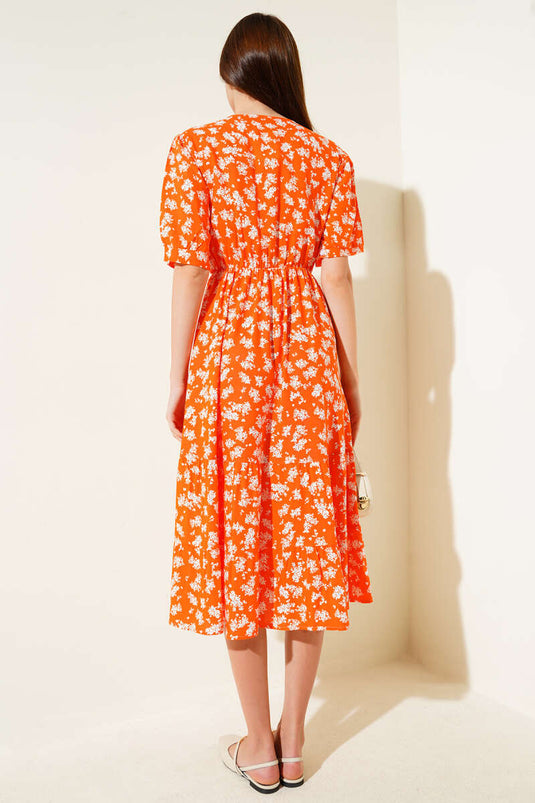 Robe orange à fleurs, taille élastique et manches courtes