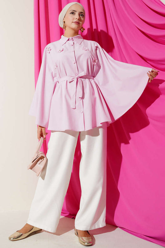 Poncho rose à motifs floraux