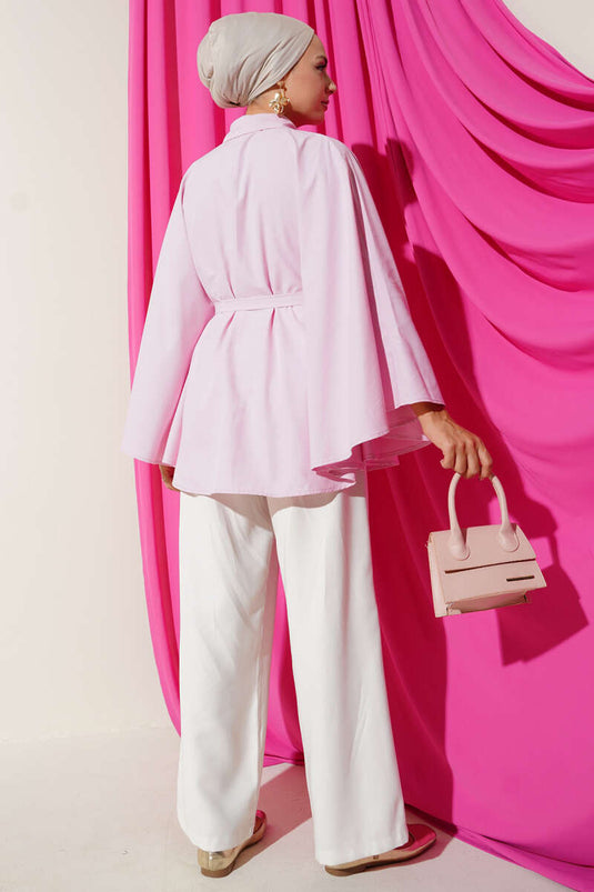 Poncho rose à motifs floraux