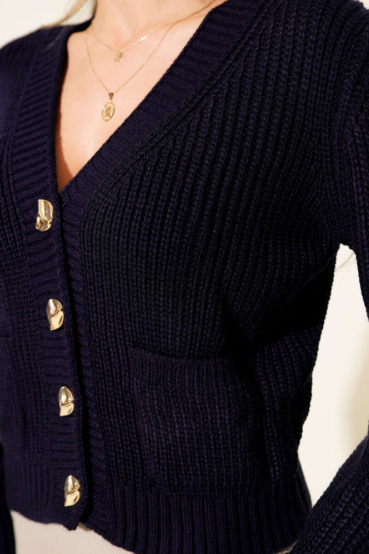 Cárdigan corto con dos bolsillos y patrón de punto acanalado, azul marino