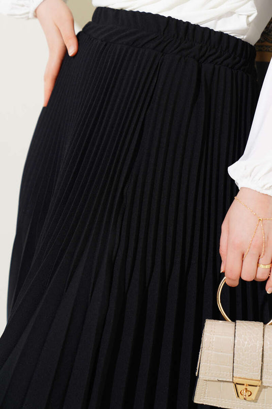 Jupe noire à plis doubles avec ceinture élastique à la taille