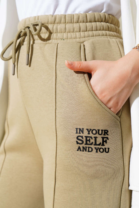 Pantalon kaki à jambes larges et ourlet élastiqué