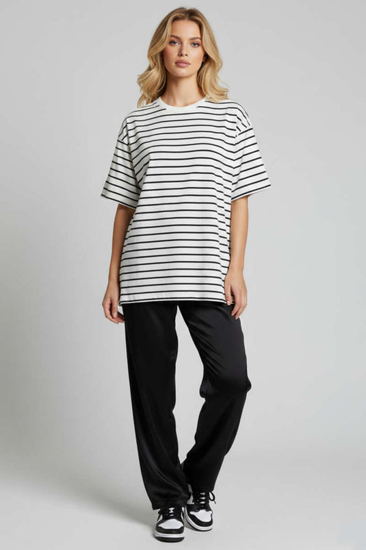 قميص واسع بتفاصيل خطوط بلون عاجي