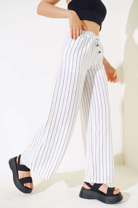 Pantalon rayé en lin blanc à taille élastique