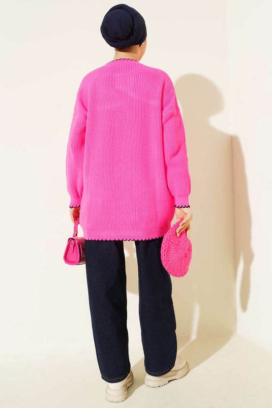 تونيك تريكو بتفاصيل درزة الراعي باللون الوردي