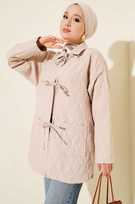 Gewatteerde jas met golfpatroon in beige