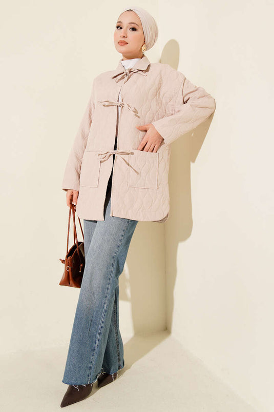 Gewatteerde jas met golfpatroon in beige