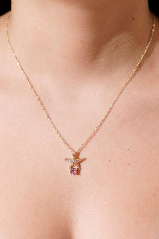 Gold Necklace with Starfish Figure and Pink Stone