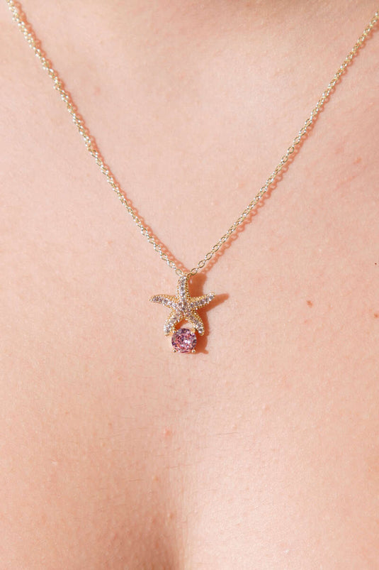 Gold Necklace with Starfish Figure and Pink Stone