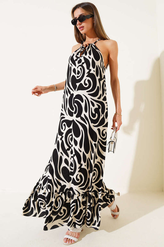 Schwarzes Kleid mit gemusterten Seilträgern