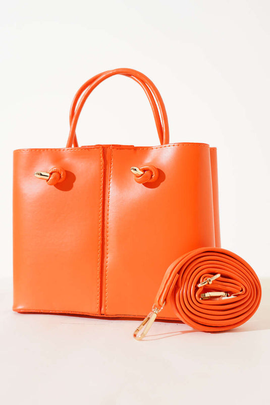 Orangefarbene Damenhandtasche mit Ziernähten