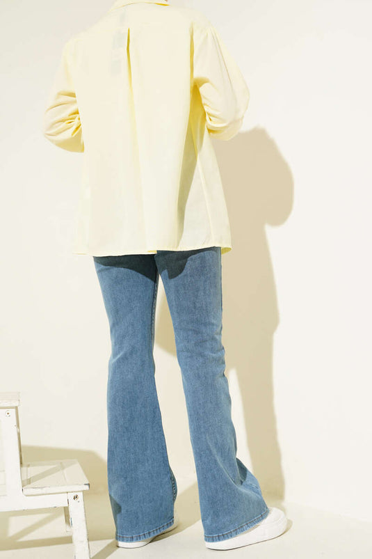 بنطلون جينز مخيط بقصة جرسية متوسطة باللون الأزرق الثلجي