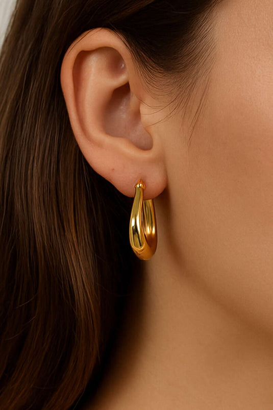 Grote, bolvormige oorringen in goud