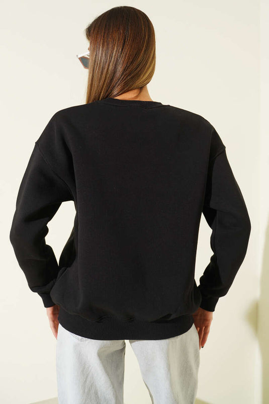 سويت شيرت أسود مطرز برسومات بطة