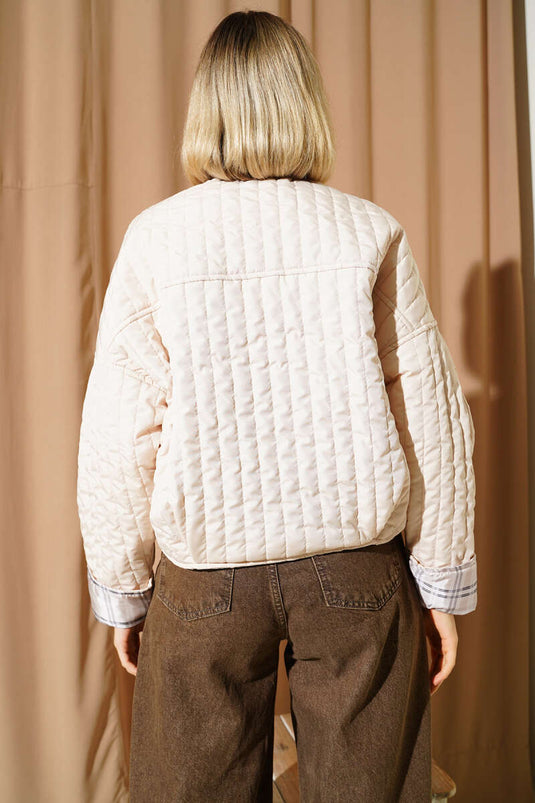 Giacca trapuntata con bottoni e pietra