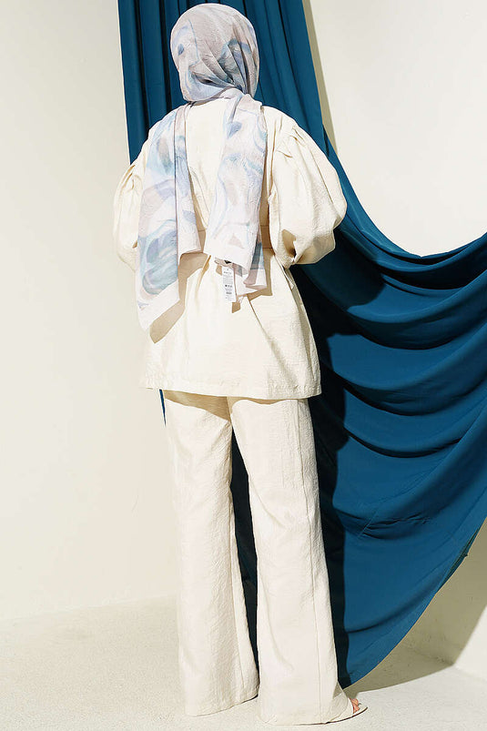 Ensemble deux pièces beige avec manches ballon boutonnées en tissu parachute