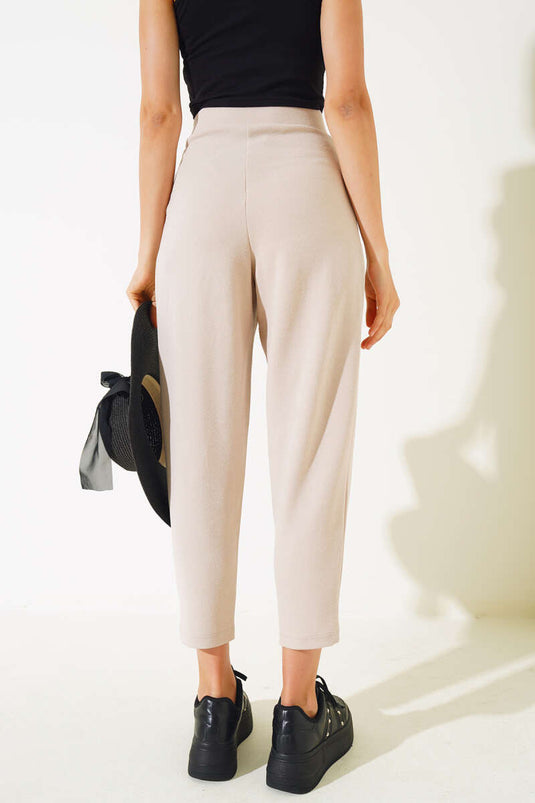 Pantalon skinny boutonné couleur pierre