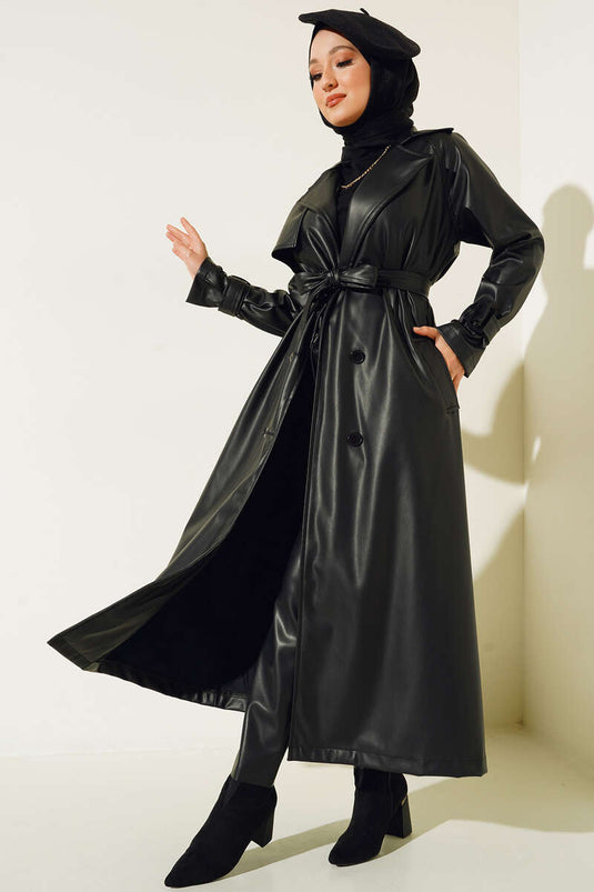 Trench-coat en cuir noir avec ceinture boutonnée
