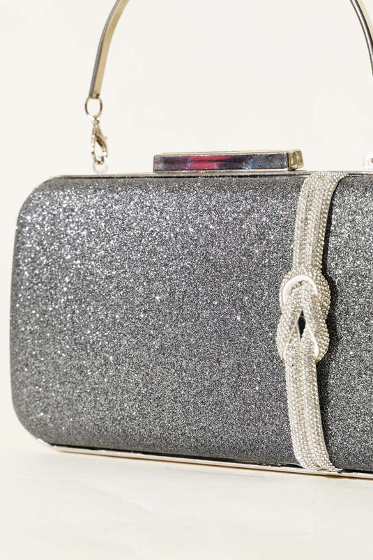 حقيبة سهرة مزينة بعقدة، لون رمادي دخاني