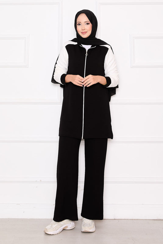 Combinaison de sport deux pièces zippée et garnie noire