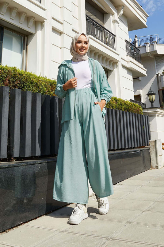 Ensemble deux pièces à capuche avec fermeture éclair et détails menthe