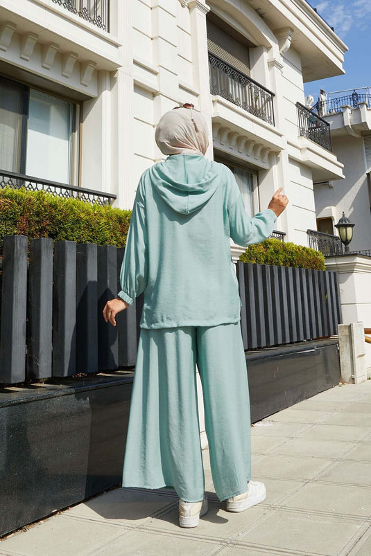 Ensemble deux pièces à capuche avec fermeture éclair et détails menthe
