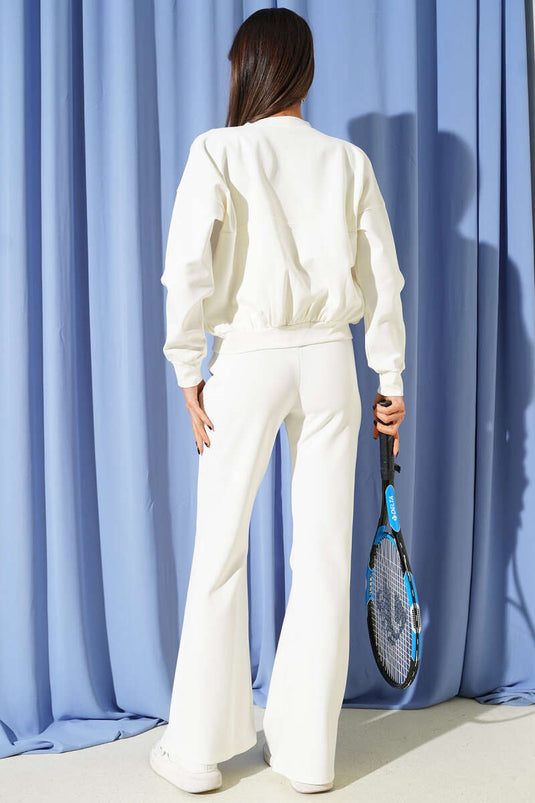 طقم مزدوج بحزام خصر مطاطي وسحاب بلون عاجي