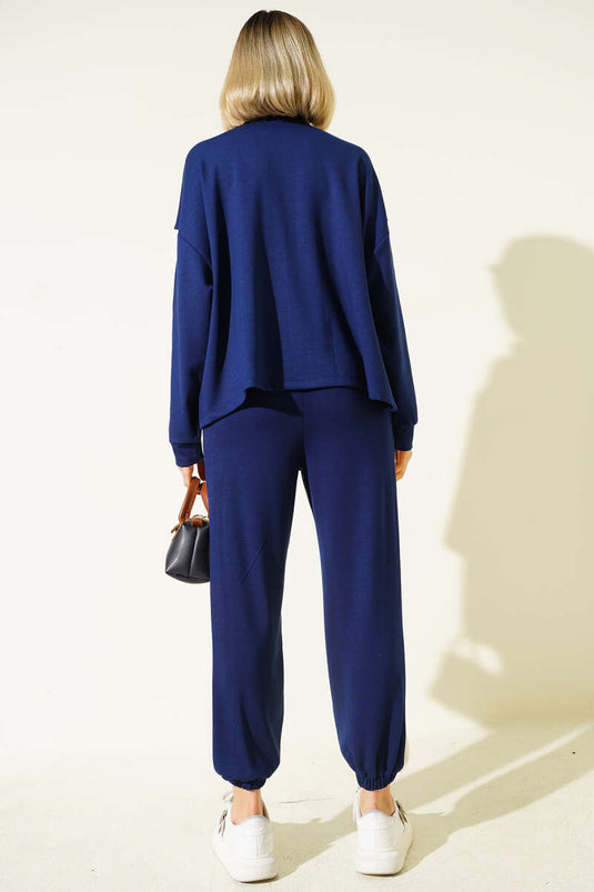 Completo due pezzi con cerniera e righe, blu navy