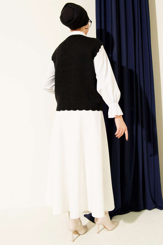 Gilet en maille noir à boutons et détails à volants